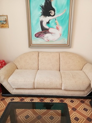 2 sofas with a free armchair