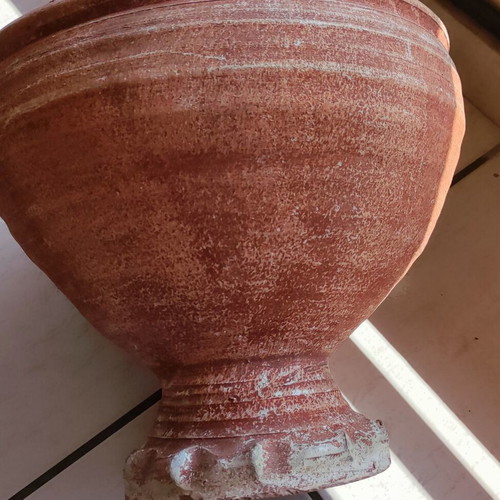 Clay flowerpot used with crack at base