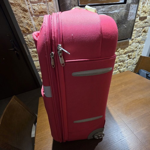 Carpisa 24" travel suitcase used, magenta color, semi-hard fabric