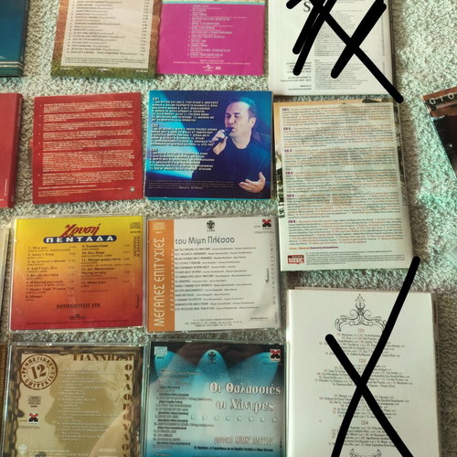 Collection of 22 Greek and international music CDs in 13 cases