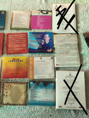 Collection of 22 Greek and international music CDs in 13 cases