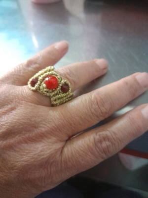 Macrame ring made to order with gold-colored thread and red stones