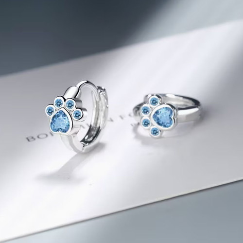 Paw print earrings new with blue stones