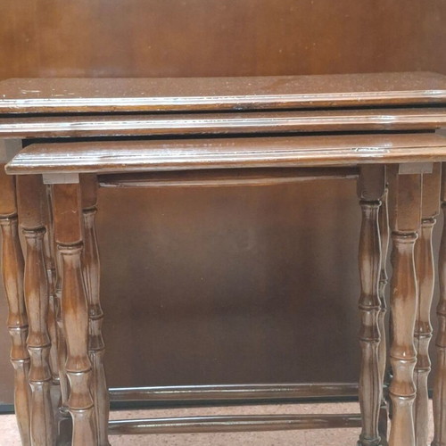 Set of three vintage wooden nesting tables, dark honey color