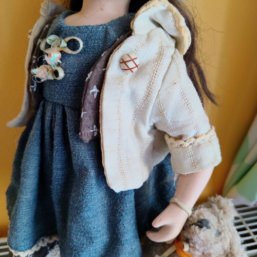 Porcelain doll with stand, 42 cm