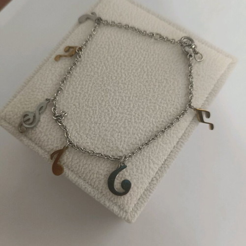 Bracelet with musical notes like new, silver