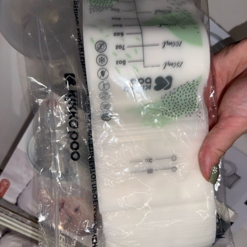 Kikkaboo electric wireless breast pump like new with 48 storage bags