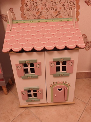 Wooden two-story dollhouse with furniture and Le Tou Van figures used