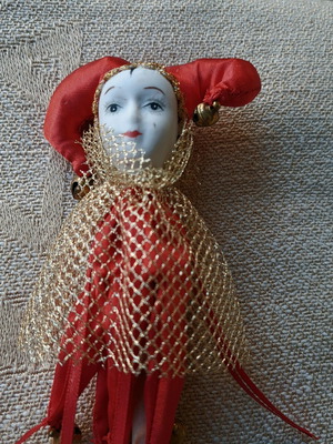 Decorative Harlequin figure on stick like new, red costume