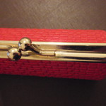 Small red wallet with gold clasp used
