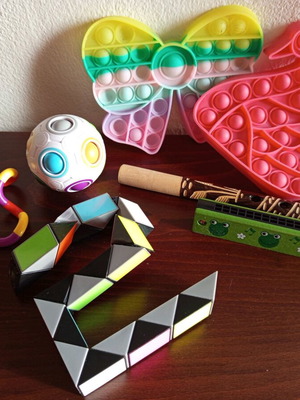 Set of fidget toys new with two wooden musical instruments