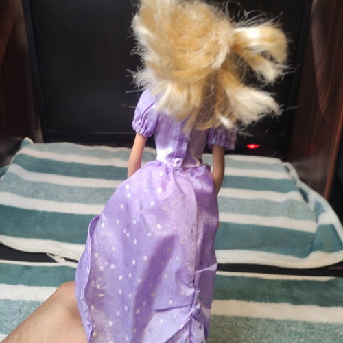 Barbie with lilac dress used, torn shoulders