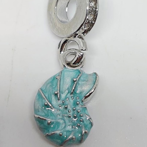 Silver charm with blue enamel Nautilus like new