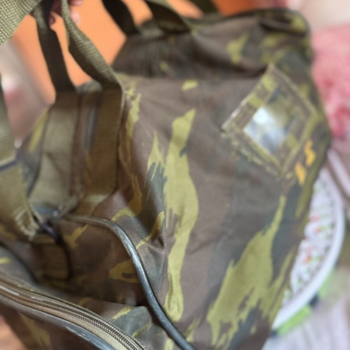 Military camouflage bag with straps used