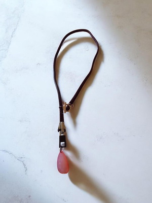 Handmade necklace with zipper and orange teardrop bead