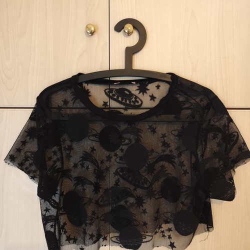 Sheer women's short-sleeve blouse with planet designs