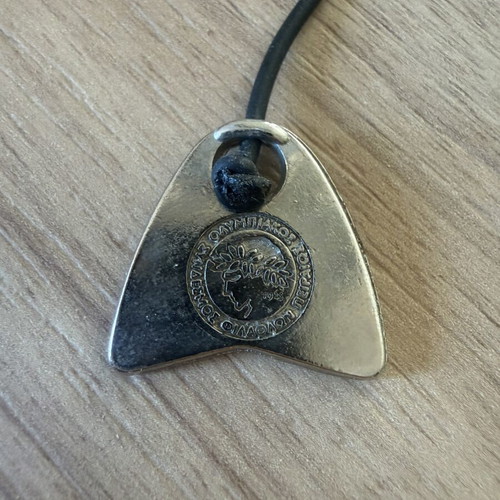 Vintage Olympiacos S.F.P. komboloi with metal elements, used