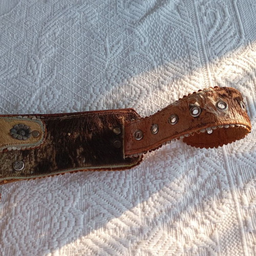 Vintage leather belt with cartridge and pistol holster used