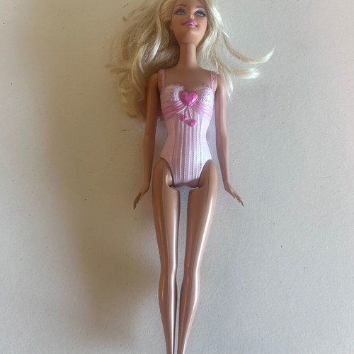 Mattel Barbie Beach doll with pink swimsuit and fuchsia dress