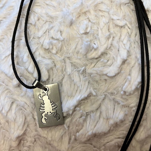 Scorpio zodiac necklace like new stainless steel with leather cord