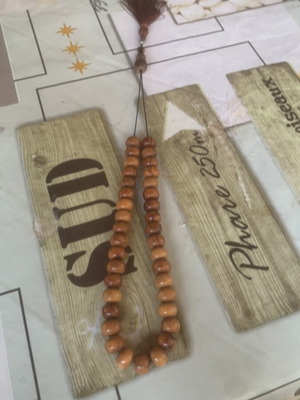 Wooden Kompoloi like new with priest figure