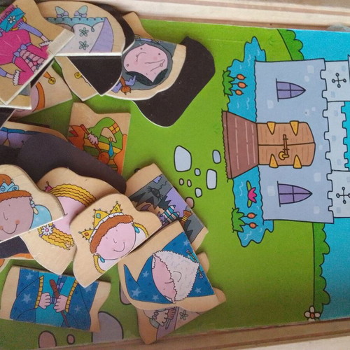 Wooden educational game with magnetic figures used, slightly worn