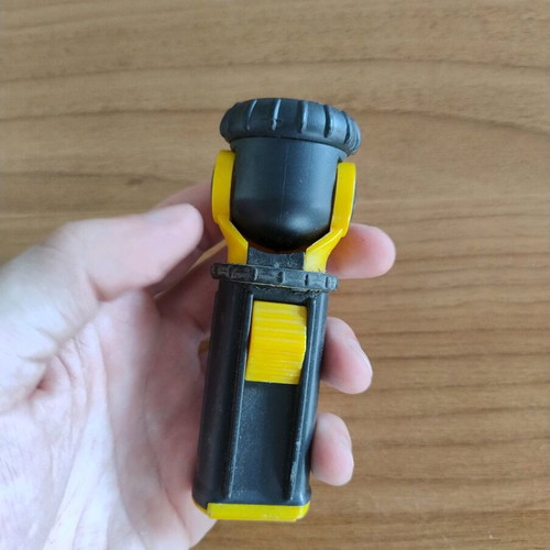 Portable flashlight with adjustable head used