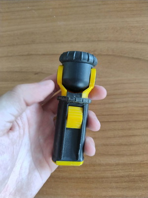 Portable flashlight with adjustable head used