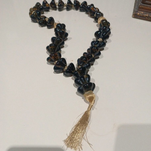 Glass worry beads green with golden threads like new