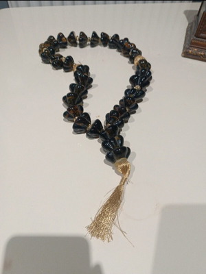 Glass worry beads green with golden threads like new