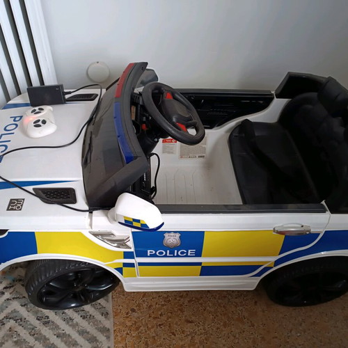 Children's police toy car like new with charger and remote control