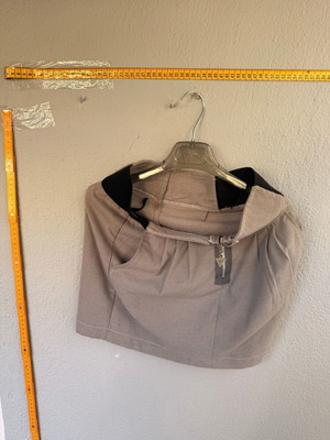 Beige women's short skirt with black detail used