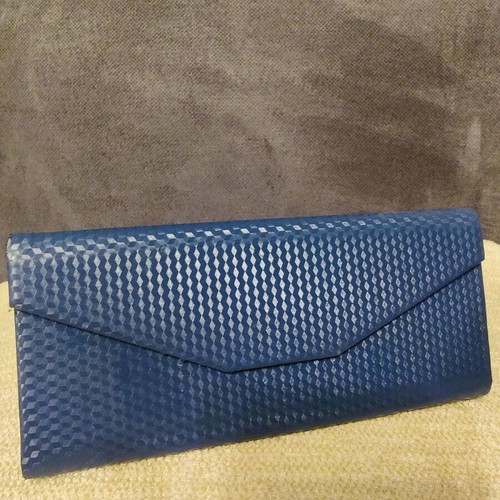 Blue leather glasses case used with magnetic clasp