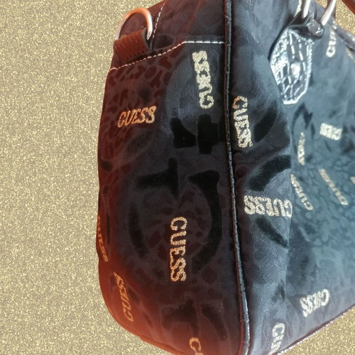 Guess vintage black handheld bag used with silver and gold details