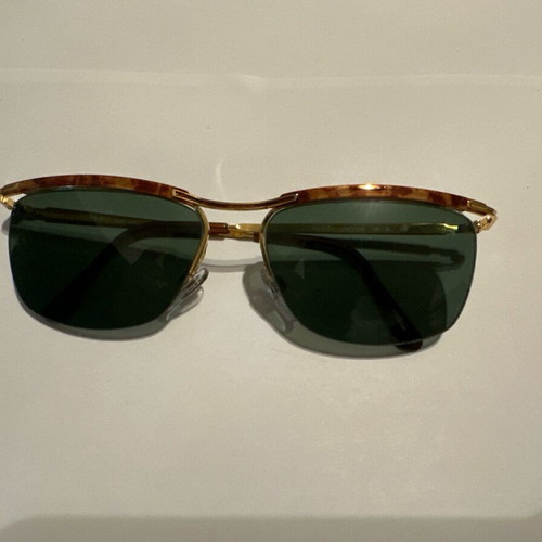Vintage Vogue sunglasses with gold metal frame and green lenses