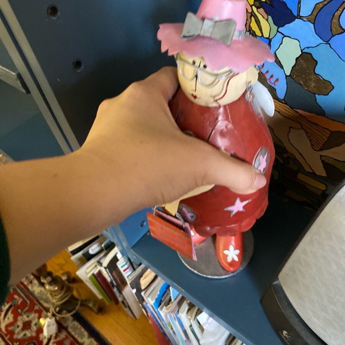 Decorative metal doll with spring like new