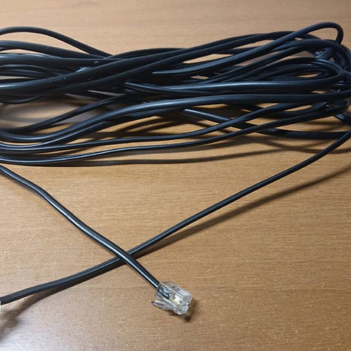 Telephone cable used 6 meters with 2 plugs black