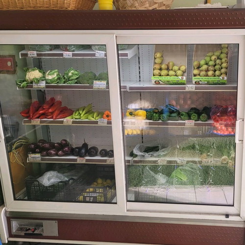 Refrigerated display case for produce used with new motor