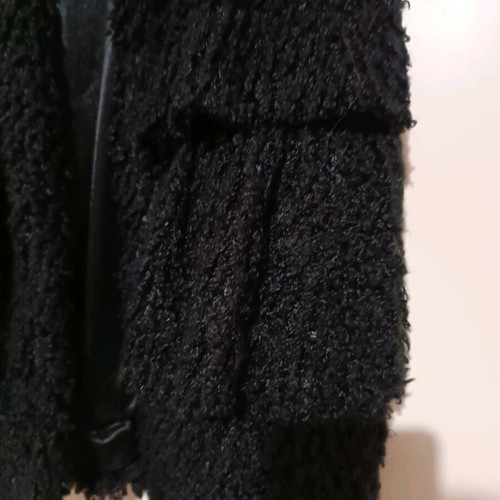 Sleeveless jacket like new, black with hood and ruffles