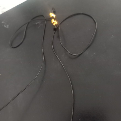 Pendant like new with subtle black and gold details
