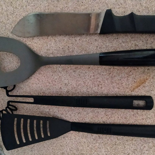 Very large knife and various kitchen utensils like new