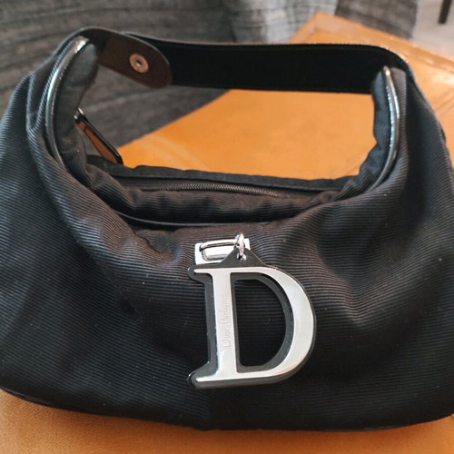 Dior small black hand bag like new with silver details