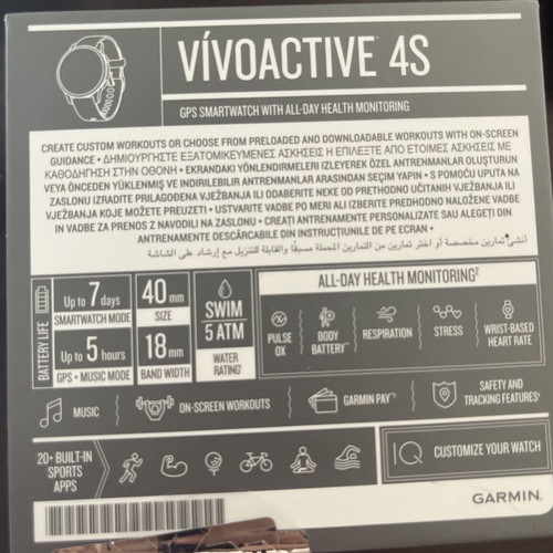 Garmin Vivoactive 4s smartwatch with charger and two straps