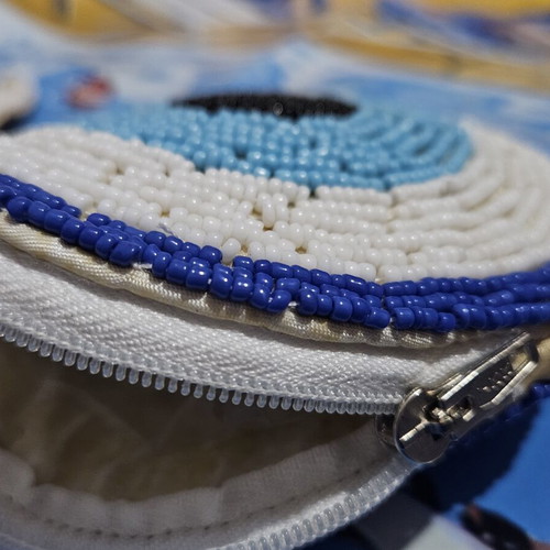 Handmade wallet with zipper, beads and eye design