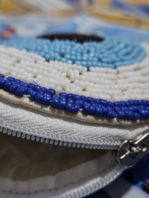 Handmade wallet with zipper, beads and eye design