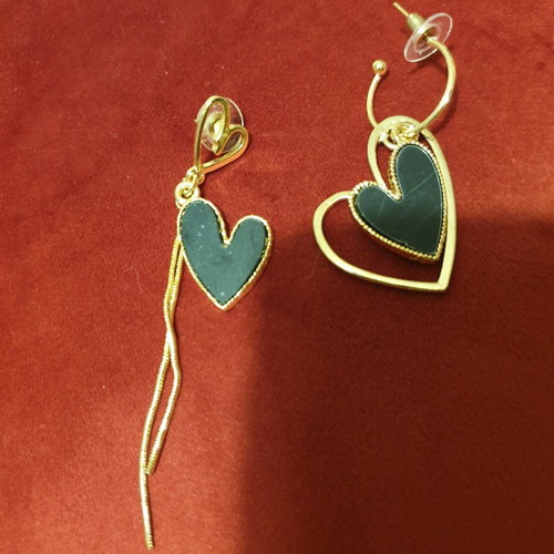 Earrings new gold with black, different design for each ear