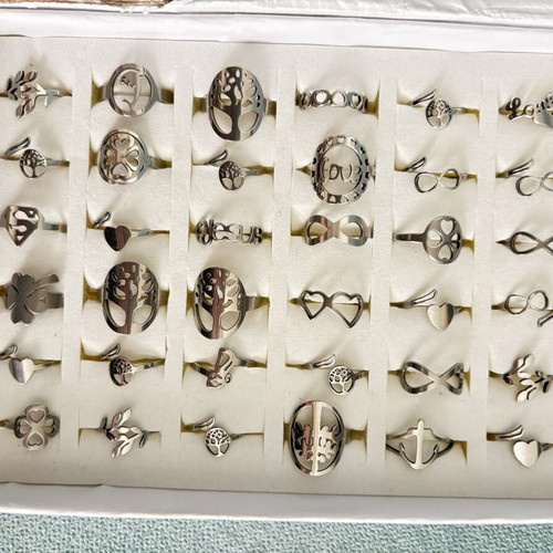 Box of 36 new steel rings with adjustable and fixed sizes