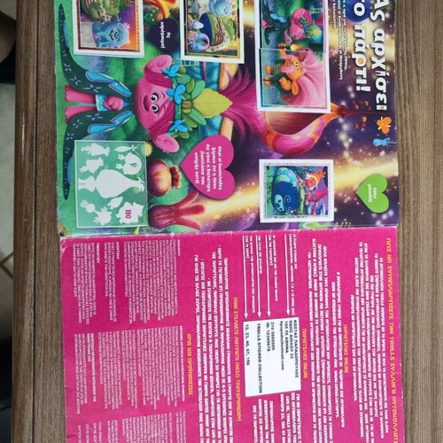 Trolls Topps sticker album used with 106 stickers attached