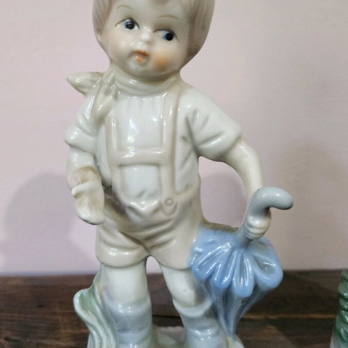 Vintage porcelain figurine set like new, children with umbrellas