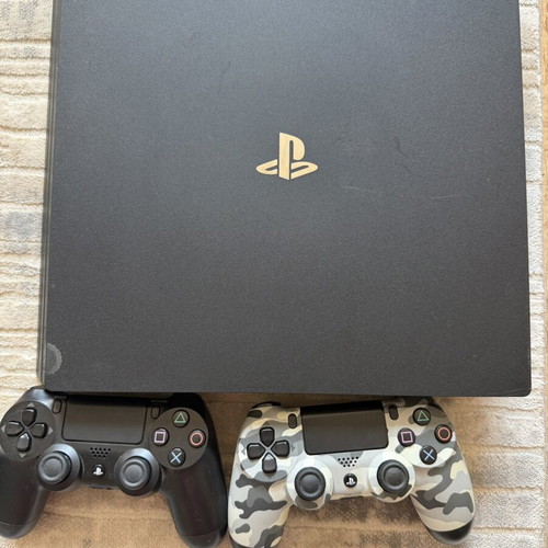 PlayStation 4 Pro 1TB console used with 2 original controllers and games